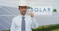 A futuristic technical expert in solar photovoltaic panels, selects the `Solar energy` function using pure renewable energy. The c