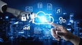 Futuristic Technology Concept with Robotic Hand Interacting with Cloud Computing Icons Symbolizing Data Exchange and Royalty Free Stock Photo