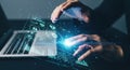 Futuristic technology concept showing hands interacting with glowing digital interface over laptop Royalty Free Stock Photo