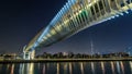 Futuristic Pedestrian Bridge over the Dubai Water Canal Illuminated at Night timelapse hyperlapse, UAE. Royalty Free Stock Photo