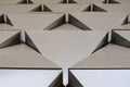 Futuristic Wall of relief metallic triangles. 3d geometric background. low angle view Royalty Free Stock Photo