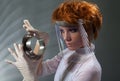 Futuristic woman examine metal detail