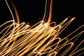 Futuristic yellow tangled fiber abstract lights on a dark background