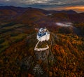 Fuzer, Hungary - Aerial view of the beautiful Castle of Fuzer with amazing colorful sunrise sky and clouds on an autumn morning