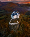 Fuzer, Hungary - Aerial view of the beautiful Castle of Fuzer with amazing colorful sunrise sky and clouds on an autumn morning