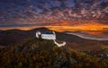 Fuzer, Hungary - Aerial view of the beautiful Castle of Fuzer Fuzeri var with amazing colorful foggy sunrise sky and clouds