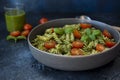 Fuzzily Italian pasta with pesto on black concrete background. Royalty Free Stock Photo