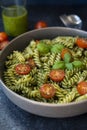 Fuzzily Italian pasta with pesto on black concrete background. Royalty Free Stock Photo