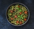 Fuzzily Italian pasta with pesto on black concrete background. Royalty Free Stock Photo