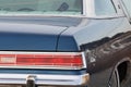 Fuzzy dice hang from mirror in LeSabre vintage car Royalty Free Stock Photo