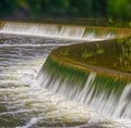 Fuzzy flows of the Penman Falls with froth at its bottom, Paris, ON, Canada Royalty Free Stock Photo