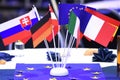 A few flags of EU member states on a table