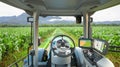 5G autonomous tractor working in corn field, Future technology with smart agriculture farming concept