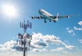 5G Cell phone or mobile service tower with aircraft approaching to land Royalty Free Stock Photo