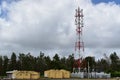 4G and 5G cell site with a supply station. Telecommunication tower with antennas.