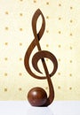 G-clef icon carved from wood