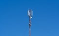 Technology on the top of the telecommunication GSM 4G tower antenna, transmitter, blue sky