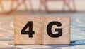 4G letters on wooden cubes. Fast internet connection technology concept