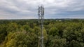 3G, 4G, 5G. Mobile phone base station Tower. Development of communication system in npn-urban forest area with dark