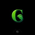 G monogram. Green G letter with leaf, isolated on a dark background.