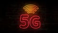 5G neon symbol on brick wall