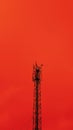 5g network antenna tower. Fast speed connection. Red toned. Bottom view. Royalty Free Stock Photo