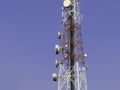 5G telecommunication tower 5G mobile phone wireless antenna machine Located in the center of the city against a blue sky backgroun Royalty Free Stock Photo