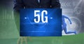 5g text on blue banner over mid section of businessman against green technology background Royalty Free Stock Photo
