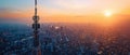 5G tower over city at sunrise, warm colors, birdseye view, highres photo , professional color grading Royalty Free Stock Photo