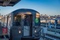 The G train pulling into the Smith St station at sunrise