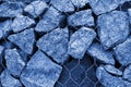 Gabion wall closeup. Textured background toned in Classic Blue color