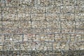 Gabion Wall From Rocks And Stones In Metal Wire Box. Fence of stones in the grid. Protective stone wall in the grid Royalty Free Stock Photo