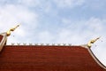 Gable apex on blue sky