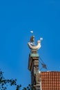 Gable mounted historic sailboat on building.