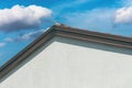 Gable roof, house roofing with sky in background Royalty Free Stock Photo