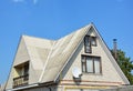 Gable and Valley type of roof construction. Building attic white brick house construction with different types of roof designs Royalty Free Stock Photo