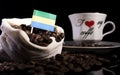 Gabon flag in a bag with coffee beans isolated on black