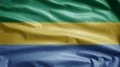 Gabonese flag waving in the wind. Close up of Gabon banner blowing soft silk