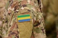 Gabonese Republic flag on soldiers arm. Gabon troops collage