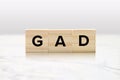 GAD Mental Health Concept on Wood Tiles - Generalized Anxiety Disorder