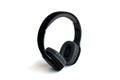 Black headphones are on a white isolated background. Royalty Free Stock Photo