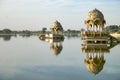 Gadi Sagar temple on Gadisar lake with reflection.