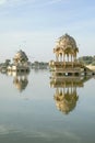 Gadi Sagar temple on Gadisar lake with reflection.