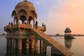 Gadi Sagar temple on Gadisar lake at sunset, Jaisalmer, India