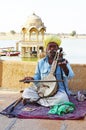 Musician with Sarod at Gadsisar Sagar Lake, Jaisalmer, Rajasthan, India