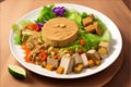 Gado-gado vegan salad with cooked vegetables, tofu, and peanut sauce