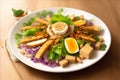 Gado-gado vegan salad with cooked vegetables, tofu, and peanut sauce