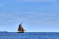 Gaff Rigged Sailing Boat on smooth sea Royalty Free Stock Photo