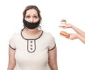 Gagged plus size woman seduced with junk food Royalty Free Stock Photo