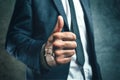 Gaining bosses approval, businessperson gesturing thumb up Royalty Free Stock Photo